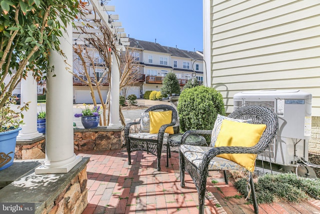 13824 Custis Sq, Woodbridge, VA 22191 - view of patio with a residential view and central AC