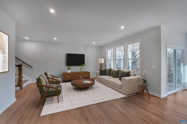 2963 Rambling Brook Ln, Crozet, VA 22932 - living area with a wealth of natural light, recessed lighting, wood finished floors, and stairs