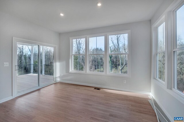 2963 Rambling Brook Ln, Crozet, VA 22932 - spare room featuring wood finished floors, baseboards, and a healthy amount of sunlight