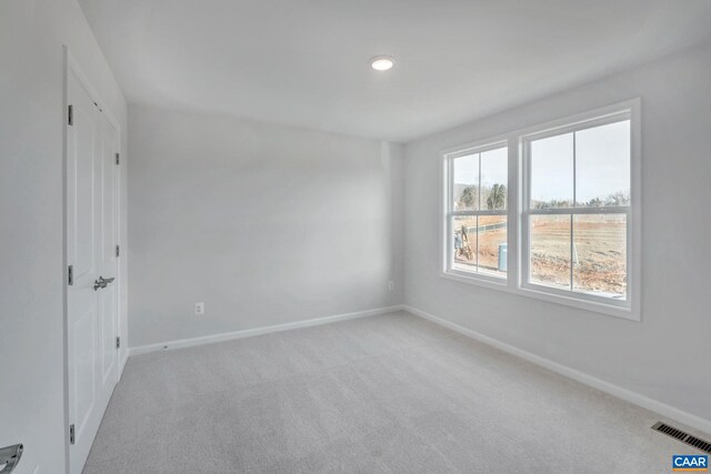 2963 Rambling Brook Ln, Crozet, VA 22932 - empty room featuring visible vents, baseboards, and light carpet