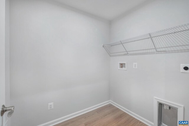 2963 Rambling Brook Ln, Crozet, VA 22932 - washroom featuring baseboards, light wood-type flooring, laundry area, electric dryer hookup, and hookup for a washing machine