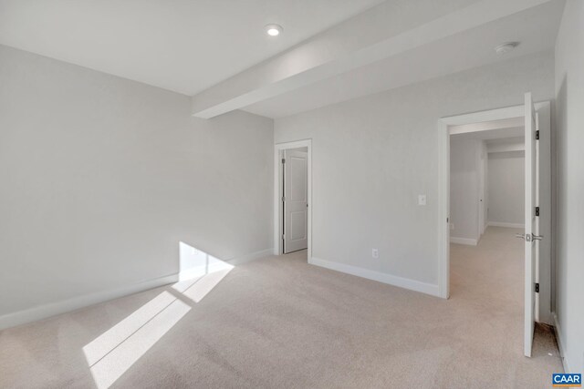 2963 Rambling Brook Ln, Crozet, VA 22932 - unfurnished bedroom featuring light carpet, baseboards, and beamed ceiling