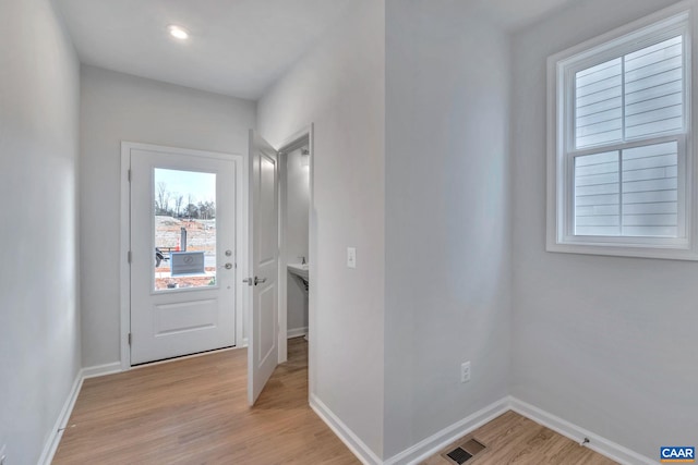 3041 Rambling Brook Ln, Crozet, VA 22932 - doorway to outside featuring light wood-style flooring, baseboards, visible vents, and recessed lighting