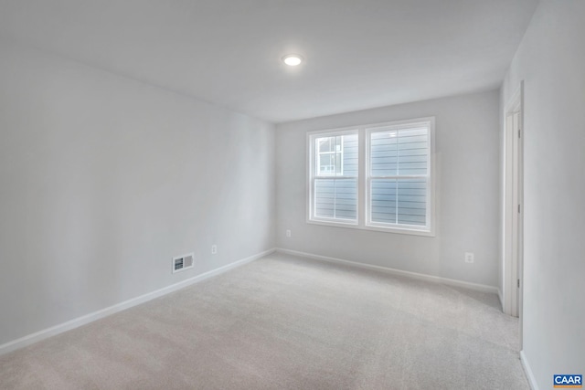 3041 Rambling Brook Ln, Crozet, VA 22932 - spare room with visible vents, baseboards, and light colored carpet