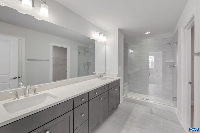 3041 Rambling Brook Ln, Crozet, VA 22932 - full bath with a stall shower, double vanity, a sink, and a walk in closet