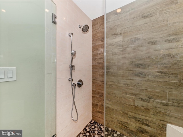 full bath featuring tiled shower