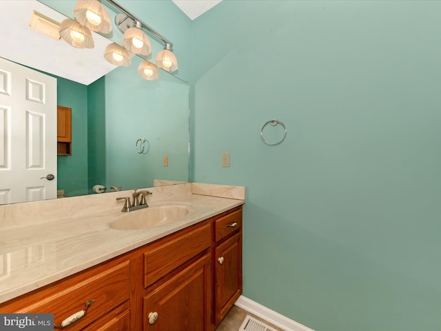 bathroom with visible vents, tile patterned floors, and vanity