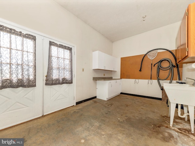 interior space featuring unfinished concrete flooring