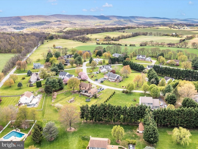 aerial view featuring a rural view and a mountain view