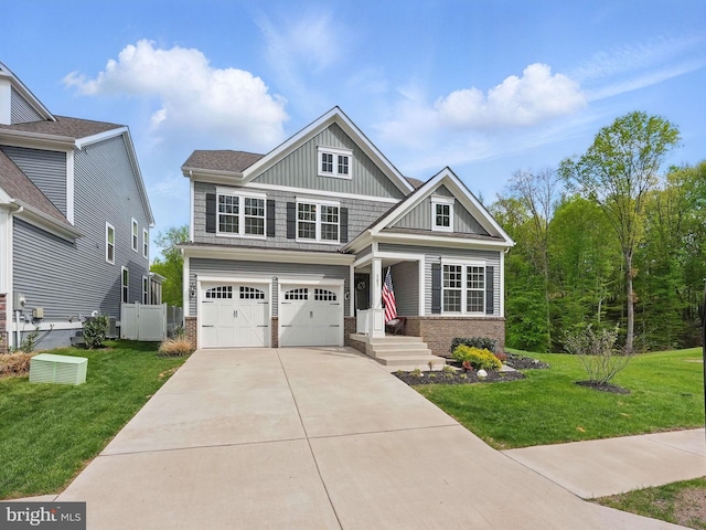 187 Boxelder Dr, Stafford, VA 22554 - craftsman-style house with board and batten siding, an attached garage, a front lawn, and driveway