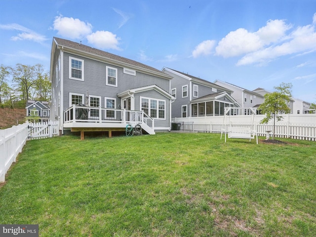 187 Boxelder Dr, Stafford, VA 22554 - back of property featuring a fenced backyard, a sunroom, a yard, and a deck