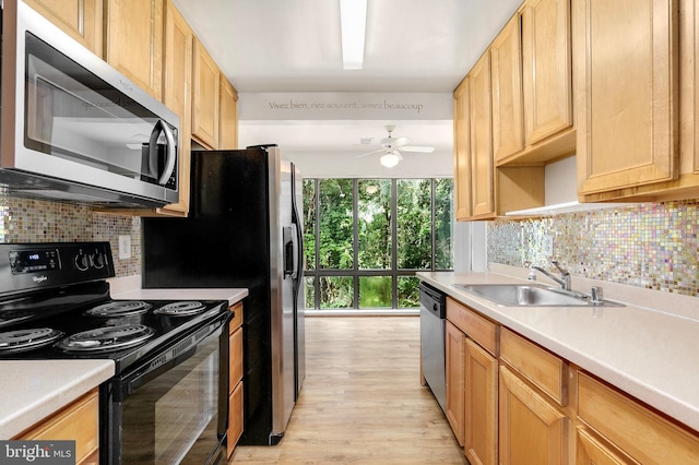8131 Needwood Rd Unit 102, Derwood, MD 20855 - kitchen featuring appliances with stainless steel finishes, a sink, ceiling fan, and tasteful backsplash