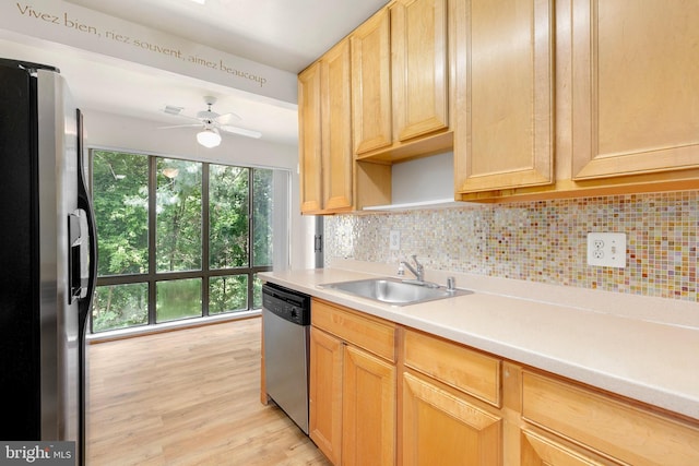 8131 Needwood Rd Unit 102, Derwood, MD 20855 - kitchen featuring appliances with stainless steel finishes, a sink, decorative backsplash, and light countertops