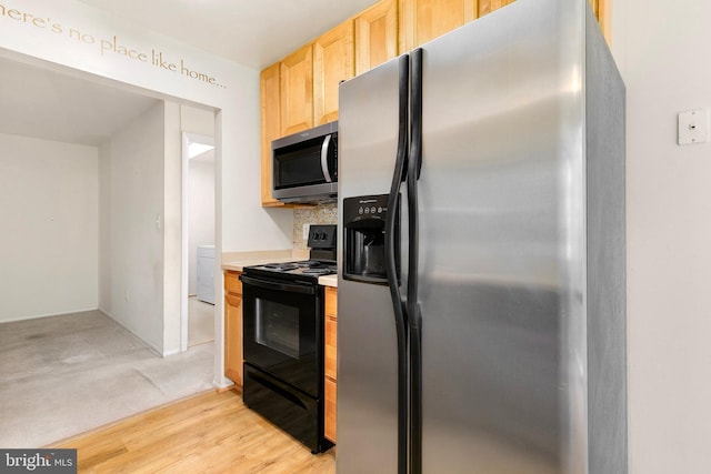 8131 Needwood Rd Unit 102, Derwood, MD 20855 - kitchen featuring appliances with stainless steel finishes, light brown cabinets, light countertops, tasteful backsplash, and light carpet