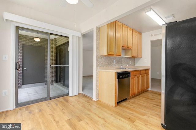 8131 Needwood Rd Unit 102, Derwood, MD 20855 - kitchen featuring appliances with stainless steel finishes, light wood-style floors, light countertops, and a sink