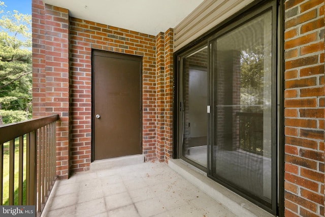 8131 Needwood Rd Unit 102, Derwood, MD 20855 - property entrance featuring brick siding and a balcony