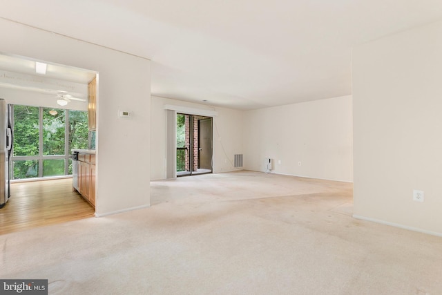 8131 Needwood Rd Unit 102, Derwood, MD 20855 - unfurnished room featuring light carpet, plenty of natural light, and baseboards
