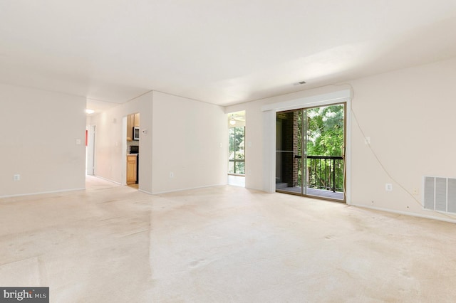 8131 Needwood Rd Unit 102, Derwood, MD 20855 - spare room with light carpet and baseboards