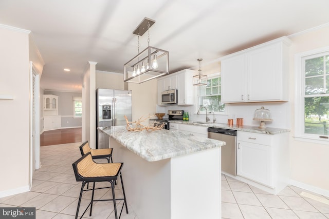 3188 Windrows Way, Eden, MD 21822 - kitchen featuring stainless steel appliances, a sink, light tile patterned flooring, a kitchen breakfast bar, and white cabinetry