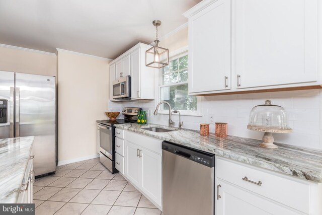 3188 Windrows Way, Eden, MD 21822 - kitchen featuring appliances with stainless steel finishes, a sink, crown molding, tasteful backsplash, and white cabinets