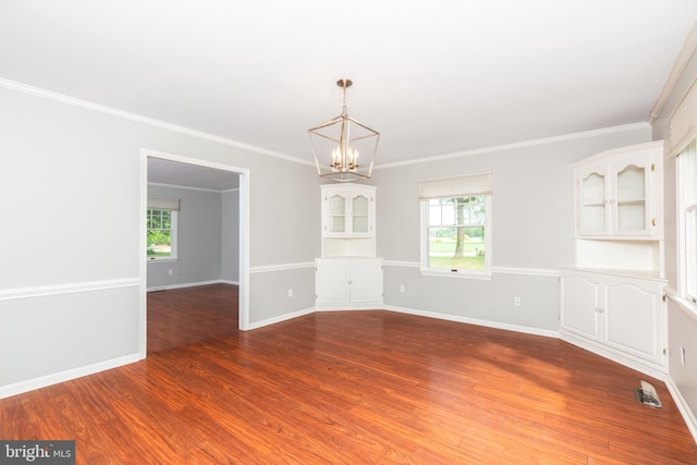 3188 Windrows Way, Eden, MD 21822 - empty room with a chandelier, wood finished floors, baseboards, and crown molding