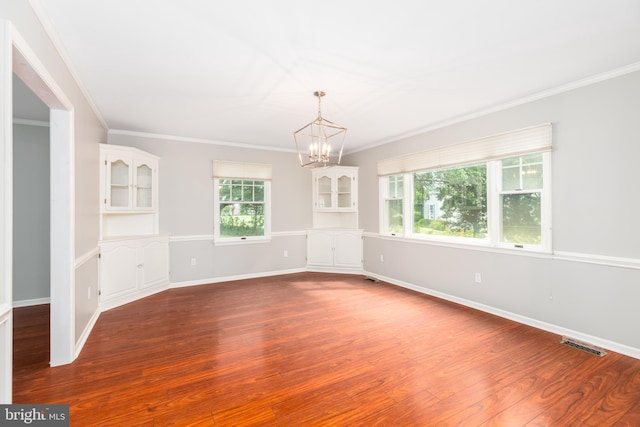 3188 Windrows Way, Eden, MD 21822 - spare room featuring a chandelier, dark wood-style floors, crown molding, and baseboards