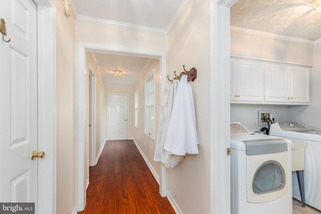 3188 Windrows Way, Eden, MD 21822 - laundry area with cabinet space, washer and dryer, wood finished floors, crown molding, and baseboards