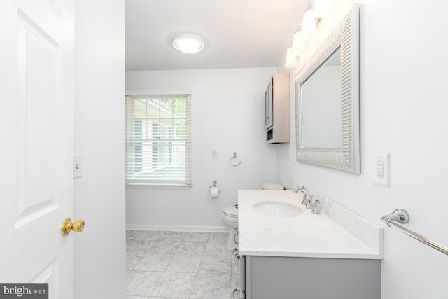 3188 Windrows Way, Eden, MD 21822 - bathroom with marble look tile flooring, vanity, toilet, and baseboards