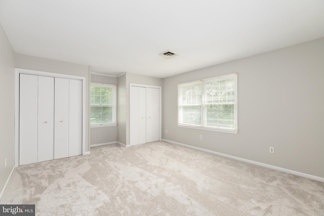 3188 Windrows Way, Eden, MD 21822 - unfurnished bedroom featuring multiple closets, carpet flooring, and baseboards