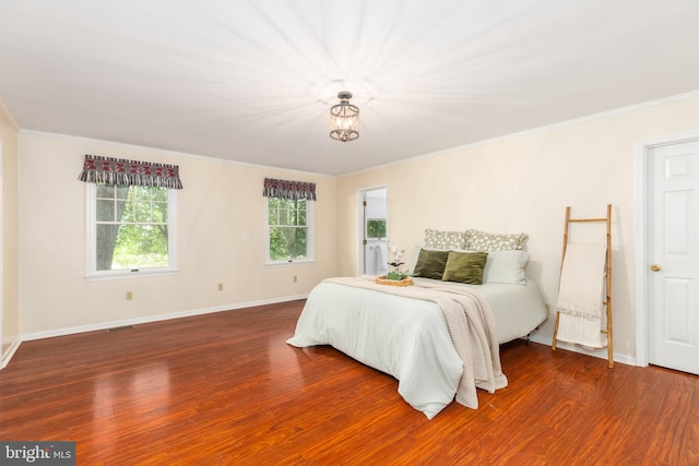 3188 Windrows Way, Eden, MD 21822 - bedroom featuring crown molding, wood finished floors, baseboards, and a chandelier