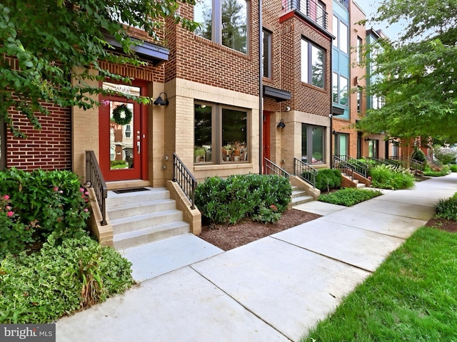 exterior space featuring brick siding