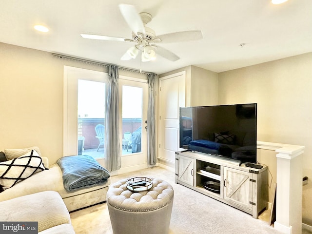 carpeted living area featuring baseboards, recessed lighting, and ceiling fan