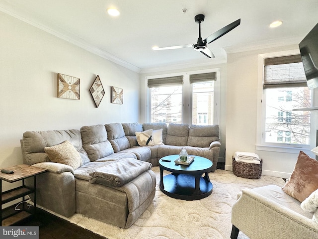 living area with a wealth of natural light, ornamental molding, and recessed lighting