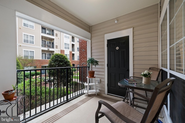 entrance to property featuring a balcony