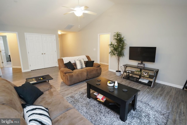 living area featuring wood finished floors, high vaulted ceiling, baseboards, and ceiling fan
