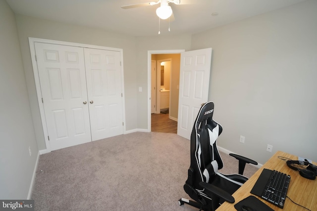 home office with a ceiling fan, carpet floors, and baseboards