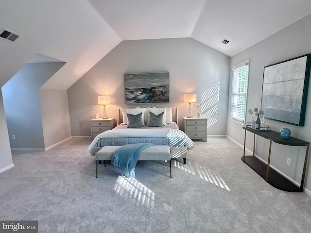 bedroom with visible vents, baseboards, carpet floors, and lofted ceiling