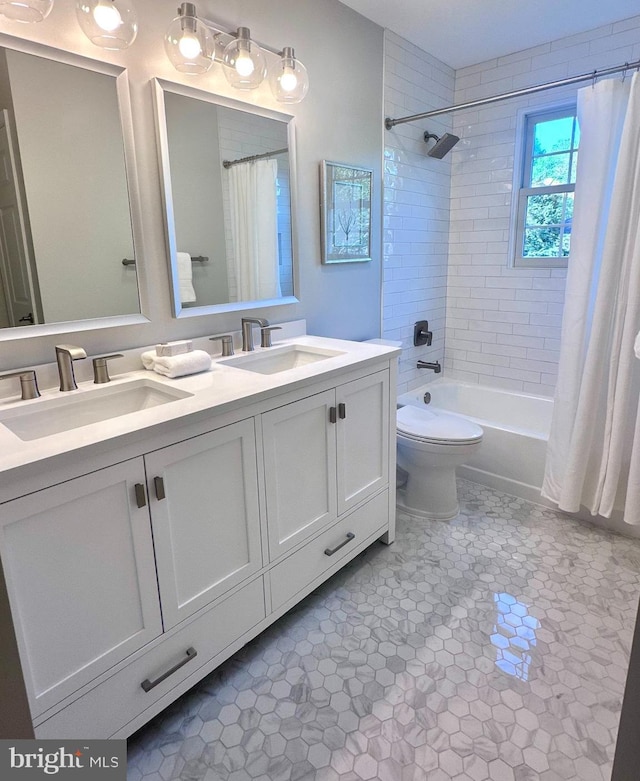 bathroom featuring a sink, toilet, shower / bathtub combination with curtain, and double vanity
