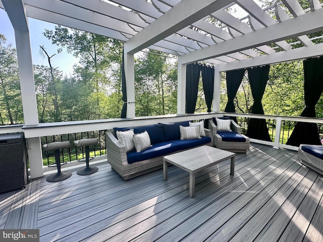 deck featuring outdoor lounge area and a pergola