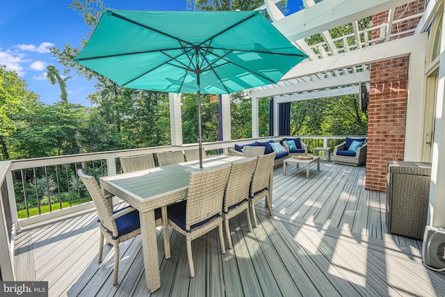 wooden terrace featuring a pergola, outdoor dining area, and an outdoor living space