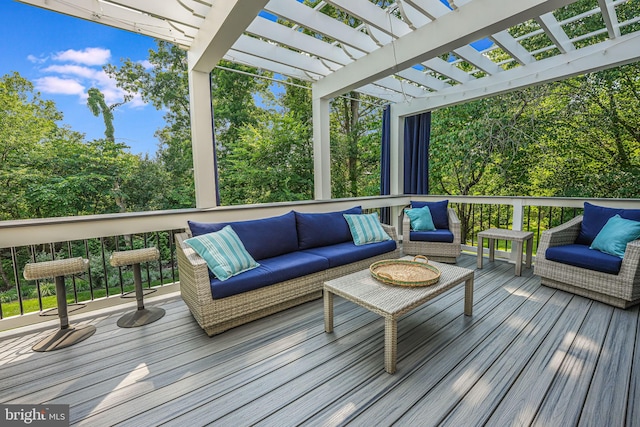 wooden deck featuring a pergola and an outdoor hangout area