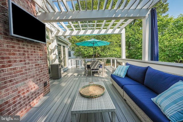 deck with a pergola, an outdoor hangout area, and outdoor dining space