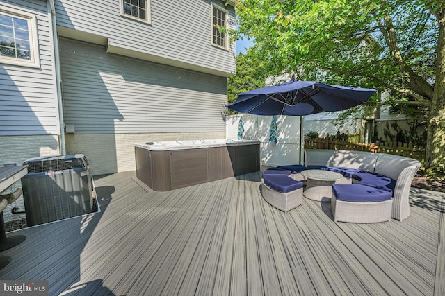 deck with central AC and a jacuzzi