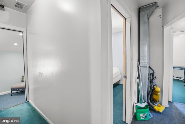 corridor with visible vents, recessed lighting, carpet, and baseboards