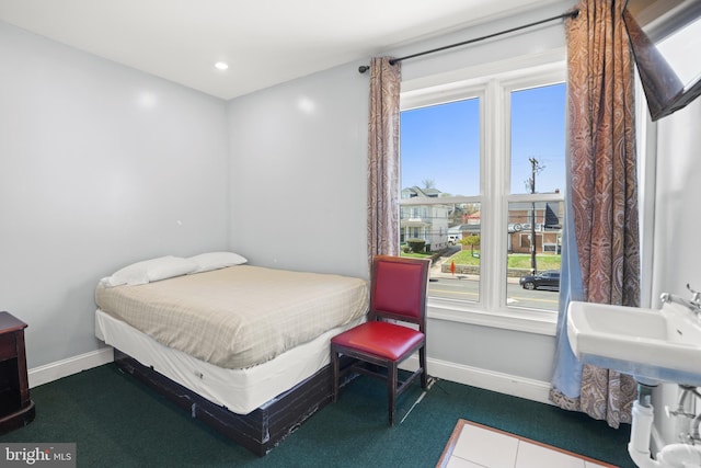 bedroom featuring baseboards