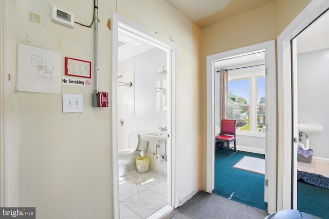 interior space featuring baseboards