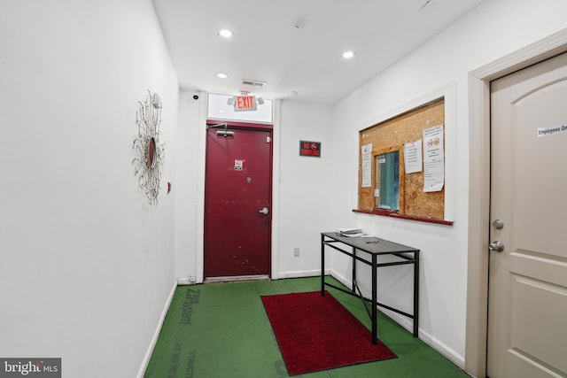 doorway to outside with recessed lighting and baseboards