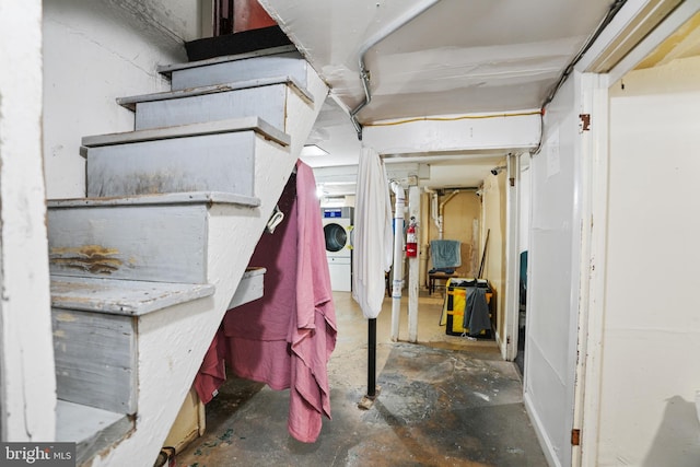 unfinished basement featuring washer / clothes dryer