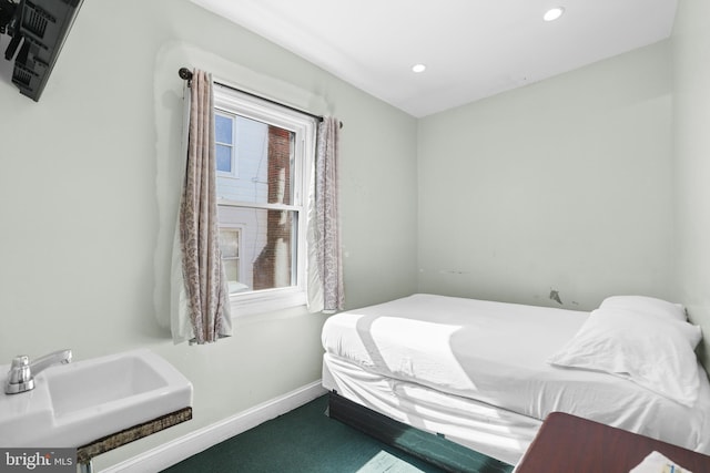 bedroom featuring recessed lighting, carpet flooring, and baseboards