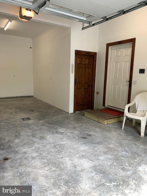 216 Tarn Dr, Oakland, MD 21550 - garage with a garage door opener